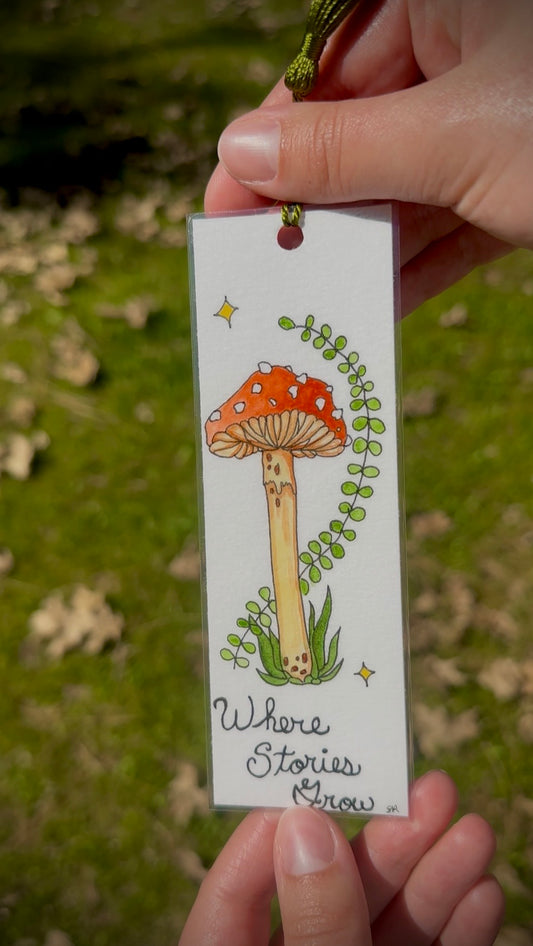 Red Mushroom Watercolor Bookmark – “Where Stories Grow” Handmade Art Bookmark with Green Tassel
