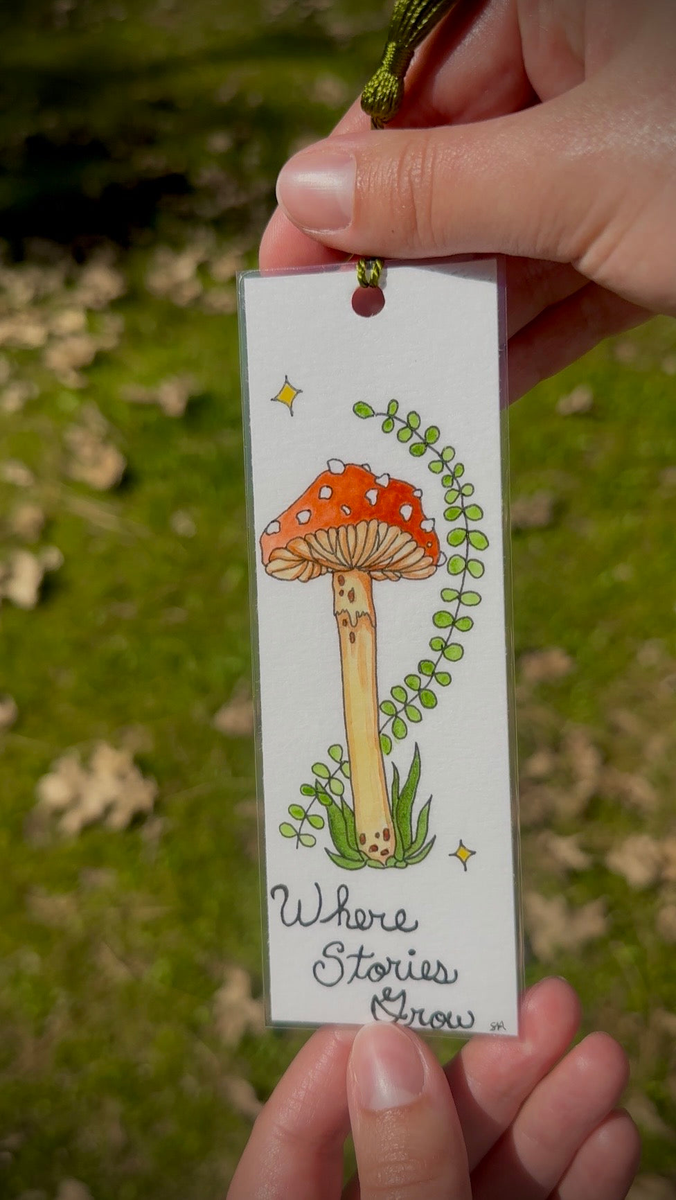 Red Mushroom Watercolor Bookmark – “Where Stories Grow” Handmade Art Bookmark with Green Tassel